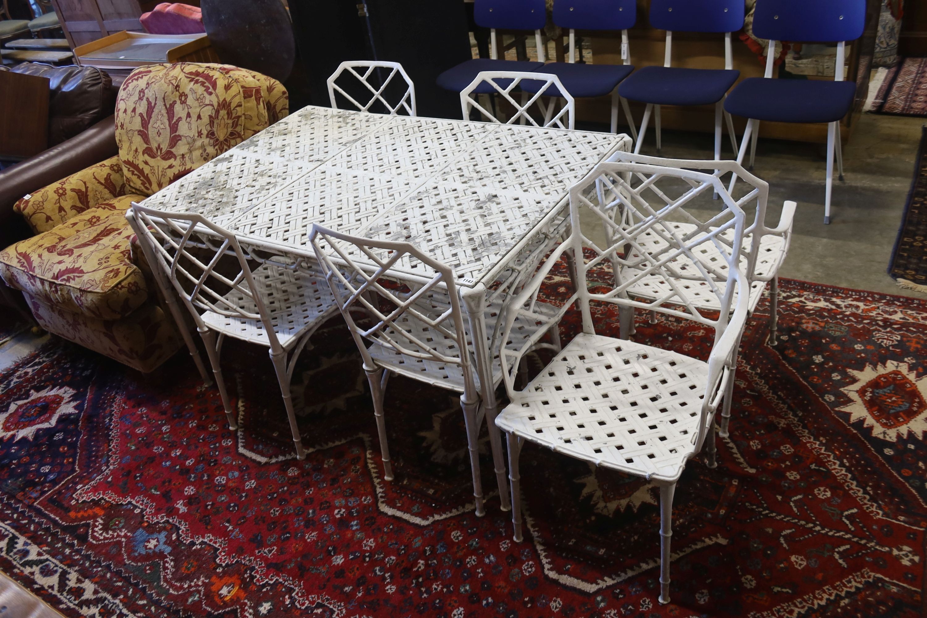 A painted aluminium faux bamboo rectangular garden table, length 130cm, depth 88cm, height 71cm and six chairs